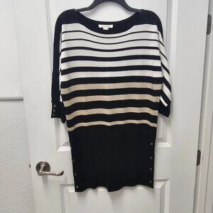 Black, white and gold dressy tunic sweater.  Fits size S-M